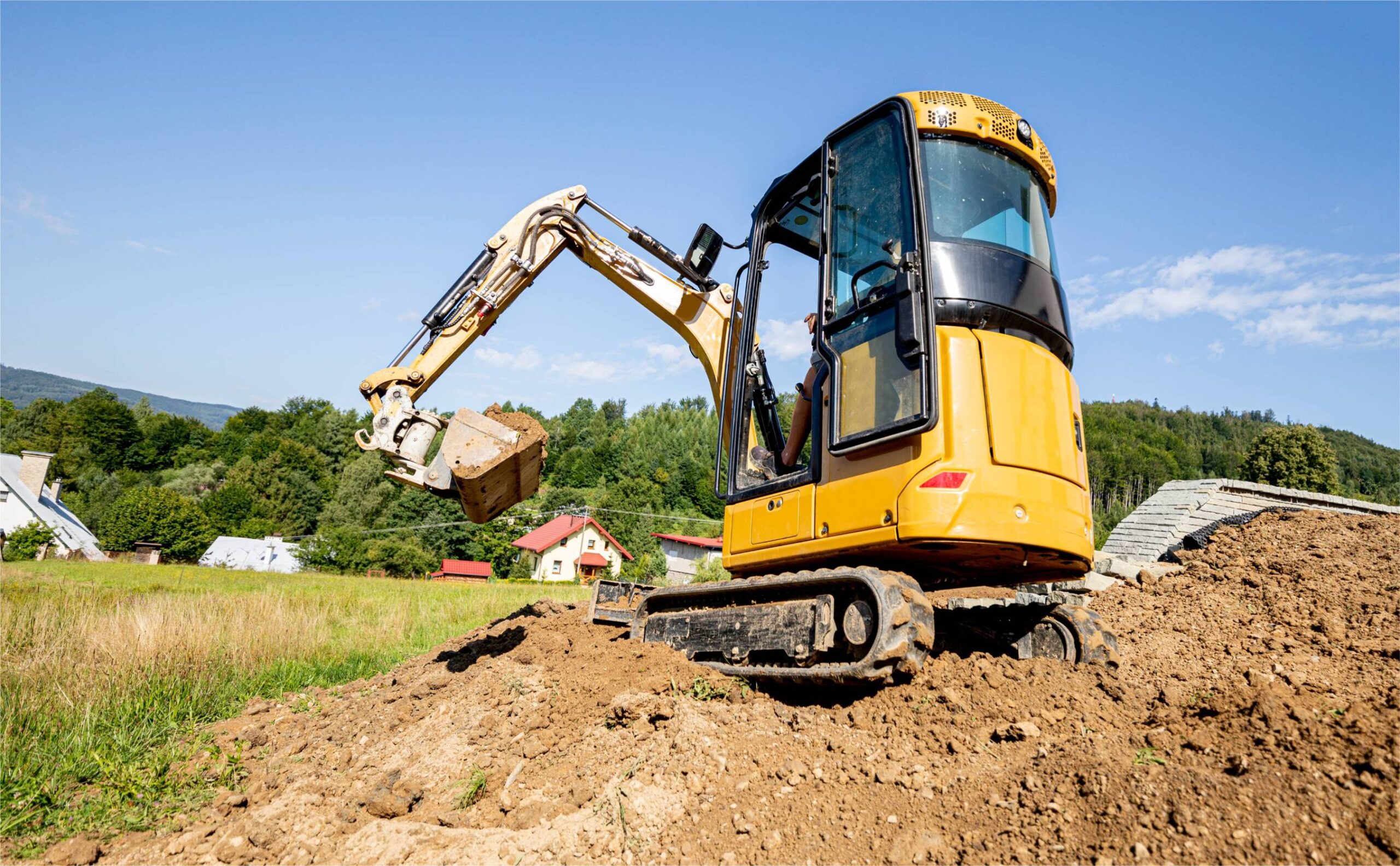 mini-excavator-digging-preparing-ground-under-home-2024-10-30-22-22-58-utc